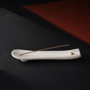 Moon-white porcelain horizontal incense holder with an unlit agarwood stick